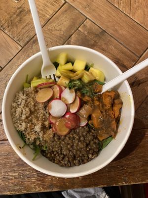 salad w/ greens, quinoa, lentils, mango, radish, &roasted pumpkin at Base V Juicery - Via dei Neri in Florence