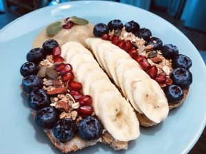Home made Peanut Butter Toast with fresh fruit and home made Granola....... at Go Vegan Cafe in Phuket