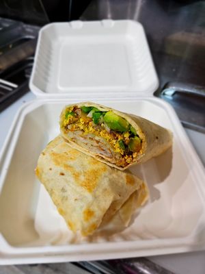 Hot Vegan Wrap: 12" flour tortilla, better planet Vegan pepperjack cheese, handcut avocado, grilled onions and fresh jalapeños, hash browns, Frank's hot sauce. at Hartland Diner  in Hartland