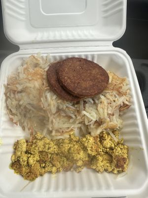 Vegan sausage, hash browns, tofu scramble  at Hartland Diner  in Hartland