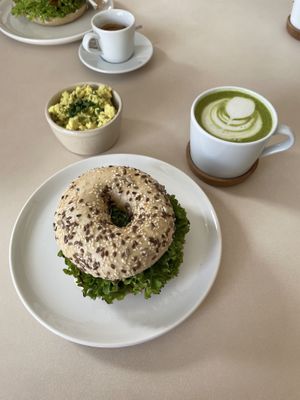 Matcha latte with scrambled tofu and bagel   at Plant Base in Berlin