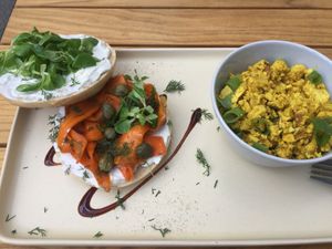 Salmon bagel with a side of tofu scramble at Plant Base in Berlin