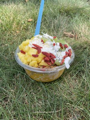 Mango glow bowl without honey and subbed GF/vegan granola  at Playa Bowls in Brighton