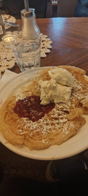 Vegan waffle with strawberry jam and vanilla ice cream. at Klockargårdens Våffleri in Grodinge