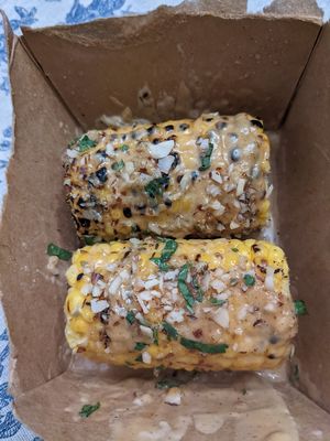 Elote - I don't know what the toppings are but they are yummy! at Vegos in Albuquerque