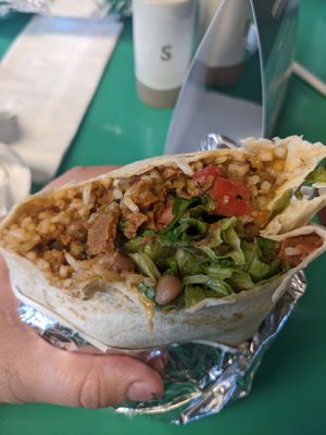 Seitan burrito, hand-held with both Chiles rojo and verde at Vegos in Albuquerque