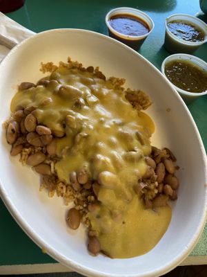 Cheesy rice and beans with sour cream, red and green chili sauce   at Vegos in Albuquerque
