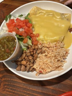 Enchilada plate with tofu. Green chili sauce on side. Rice with a bit of a kick for the 80 plus year old.😄 at Vegos in Albuquerque