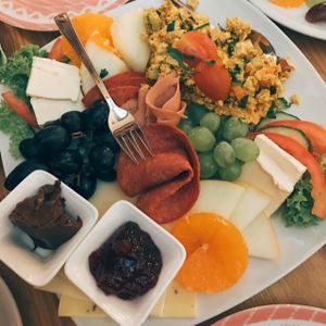vegan breakfast for two with bread, vegan tofu scramble, vegan meats, vegan cheese, vegan Nutella, vegan butter, and fruits.  at Signor Verde in Cologne