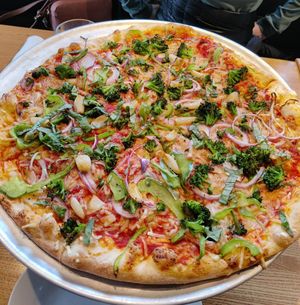 Large pizza with vegan cheese, broccoli, red onion, peppers, garlic, and basil at Piecasso in Stowe