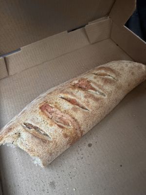 Calzone with soy cheese, vegan sausage, pineapple and jalapeño  at Brick Oven Pizzeria in Omaha