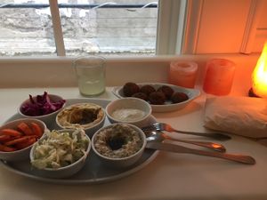 Platter full of treats. Hummus, pita, tahini, cabbages, carrots, hot fresh falafel and babbaganoush  at KoPita in Knoxville