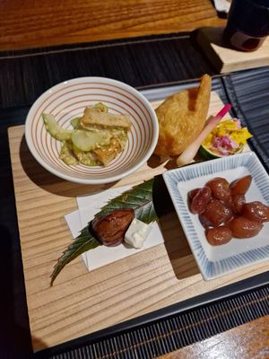 Appetisers including sesame gluten with melon, rice in tofu pocket and sweet red beans at Hanafubuki in Ito