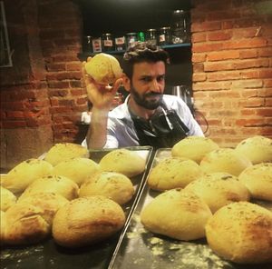 The owner and his home made breads at Le Coucou Rennais in Rennes