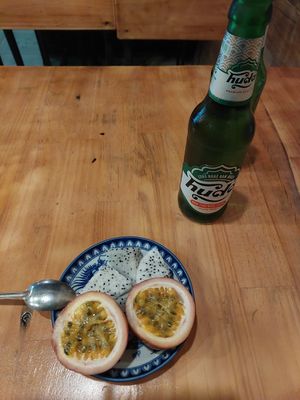 Complimentary fruit and cold local beer at Madam Thu in Hue