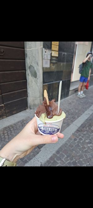 Chocolate and pitashio with vegan dark chocolate sauce at Toldo Gelateria in Lecco