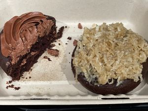 Gfs half eaten chocolate cupcake and my German chocolate cupcakee  at No Cow Bakery in Castle Rock