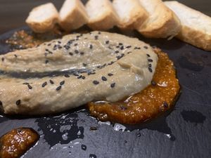 black garlic humus over almond sauce at Lolín Cafe in Badalona