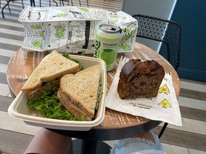 Tofu egg salad, shiitake bacon, avocado, lettuce, tomato, pickles, hemp ranch dressing. Banana bread and calamansi sparking water  at Beatnic - Fashion District in New York City