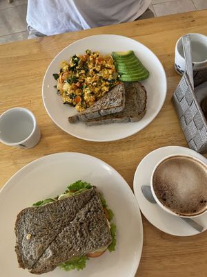 Scrambled tofu, soy cappuccino and humus avo sandwich  at CV Cafe in Kampot