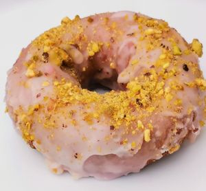 Rose glazed donut with crushed organic pistachios on top. at Namaste Donuts in Germantown