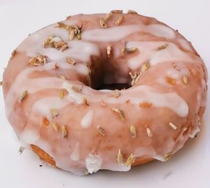 Lavender glazed donut topped with organic lavender flowers at Namaste Donuts in Germantown