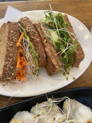 Sandwich with lot of veggies and sprouts  at Peacefood Cafe - Uptown in New York City
