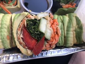 Raw sushi rolls: julienne veggies, walnut pate, nori sprouts, ginger, avocado 
  at Peacefood Cafe - Uptown in New York City
