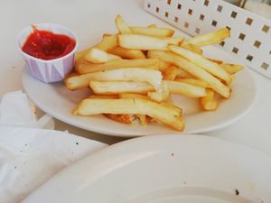 Side fries, partially eaten already at Peacefood Cafe - Uptown in New York City