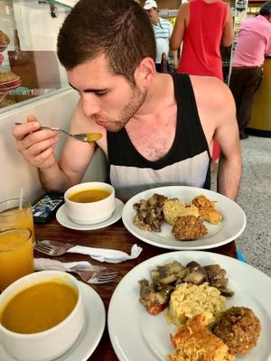 The meal was some kind of mango/orange juice, what I believe to be a butternut squash soup, brown rice, their spin on a falafel, warm eggplant salad and this pie-like thing haha. That's my non-vegan friend enjoying every last bit of it before proclaiming that it was one of his best meals in Cartagena. at Girasoles Restaurante Vegetariano in Cartagena