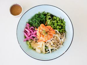 Poke Salad bowl (edamame beans, bean sprout, seaweed
salad, pickled onion & ginger, mixed salad, tofu, sesame
dressing.) at Table of Munchies in Christchurch