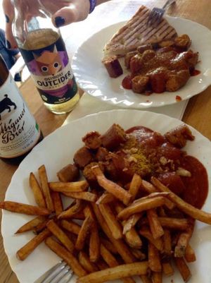 Currywurst with bread or with chips at Vleischerei in Leipzig