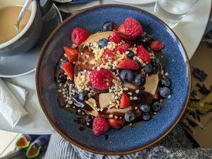 Pancakes with fruit, nuts and maple syrup at Skinny Batch Bakery in Lusk