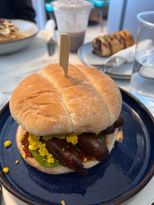 Vegan Bap and vegan sausage roll in the background  at Skinny Batch Bakery in Lusk