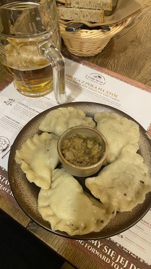Pierogi filled with sauerkraut and mushrooms. Came with a caramelised onion dressing    at Pierogarnia Stary Młyn in Gdansk