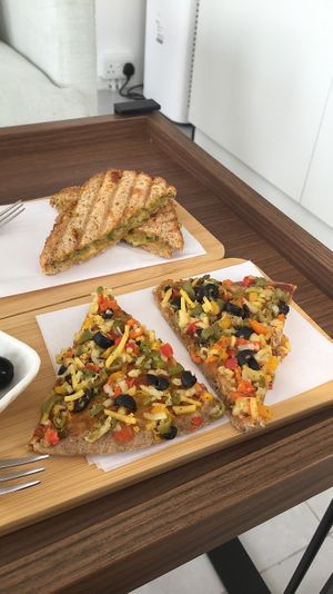 Vegan pizza & Avocado with V cheese sandwich. at 7T Healthy in Bu Quwah