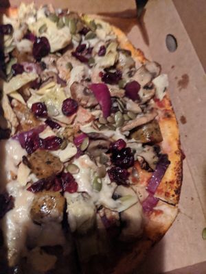 Suzy spoon with vegan polenta sausage at Antonio's Pizzeria in Sylvania Waters