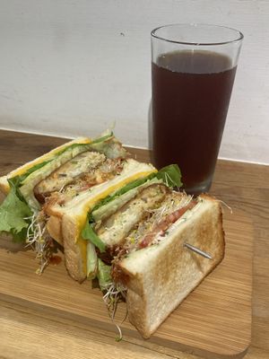 Veggie croquette sandwich with BBQ sauce and vegan cheese + black tea at Vegan Daily 半半食室 - BànBan Shí Shì in Taichung