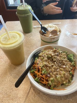 Thai Peanut bowl, Peanut butter açaí bowl, freshly squeezed juice (in the foreground), and a smoothie (in the background)  at Liquid Fresh Planet in Cleveland
