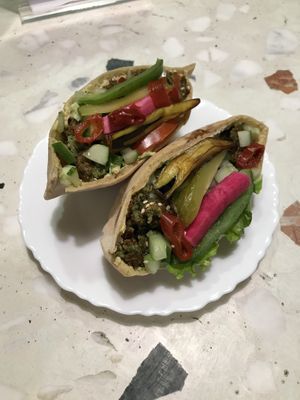 Falafel pita sandwich almost exploding with deliciousness! ☺️ at Tamu Tamu in Chennai