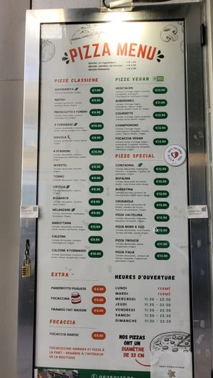 Current menu and prizes of all pizza's in French. There's also a menu on English hanging on the right at the counter. (July 14, 2024) at Da Francesco in Nice