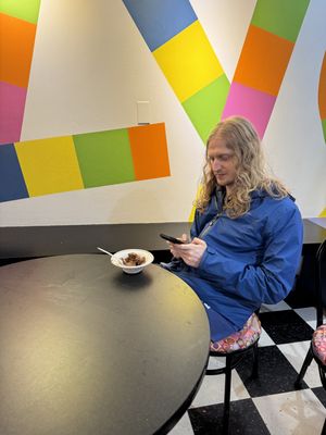 Louis eating vegan chocolate peanut butter swirl   at Izzy's Frozen Yogurt & Ice Cream in Portsmouth