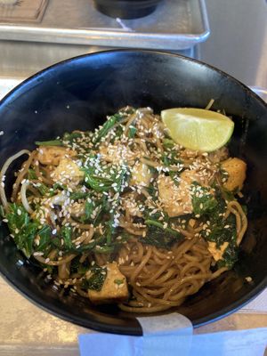 Kale, spinach, cauliflower, whole wheat noodles, tofu, sesame seeds, lime, and the garlic sauce  #Veganuary at honeygrow in Boston