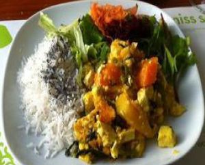 Cambodian curry with tofu, mango, pumpkin and lime leaves. And a cashew fruit and pineapple drink! Yum! at M Butterfly by Miss Saigon in Lisbon