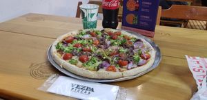 They have an awesome combo deal which includes a medium pizza and drink for 39.90 reals at Vezpa - Copacabana in Rio De Janeiro