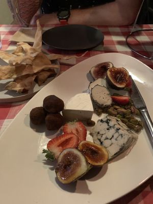 Cheese platter with ‘chevre’ ‘Camembert’ and ‘blue’. Chocolate truffles 🤤 at Caruso's in Gymea
