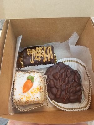 Peanut butter rice crispy dipped in chocolate, peanut cluster and carrot torte at Rheinlander Bakery in Arvada