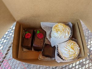Vanilla Cupcakes, a brownie, and Black Forest pastries.  at Rheinlander Bakery in Arvada