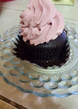 Chocolate cupcake with raspberry frosting. at Cara Mia in Lomita
