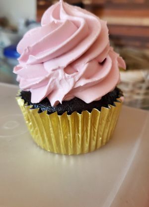 Chocolate cupcake with raspberry frosting. at Cara Mia in Lomita